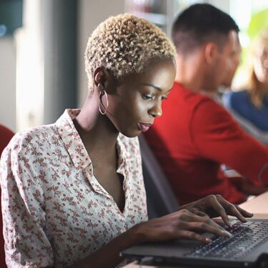 African American woman working on her laptop.