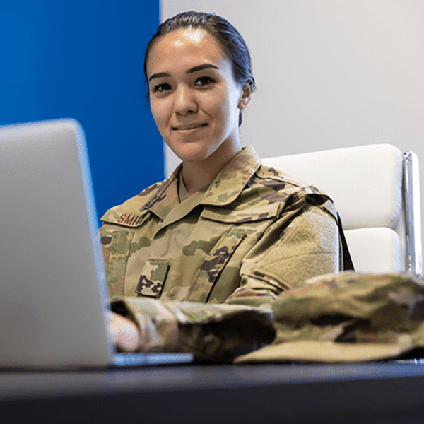 Person in Military uniform working on a computer.