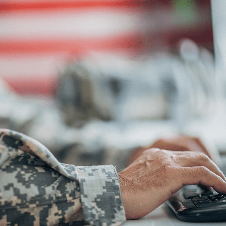 Military service member working on software development.